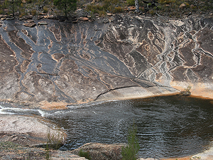 Algae stains the granite black.