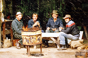 Bill Goebel, Ian Elms, Hock Goebel and Ken Day sheltering from the weather.