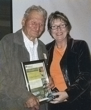 Bill receiving an award.