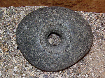 Donut shaped stone tool.