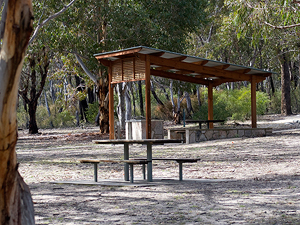 A roofed picnic area.