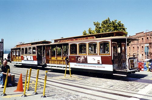 A cable car parked and waiting for passengers.