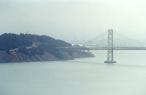 A telephoto view of the north end of the Oakland Bay Bridge.